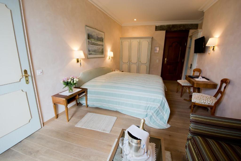 Postel nebo postele na pokoji v ubytování Romantik Hotel Castello Seeschloss