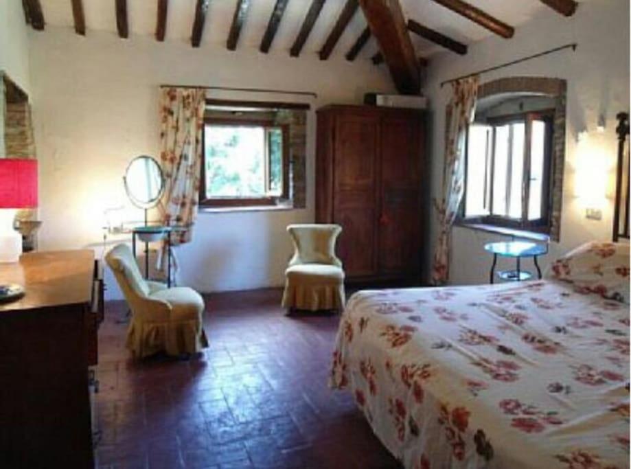 Posteľ alebo postele v izbe v ubytovaní Antica casa colonica in pietra in Toscana
