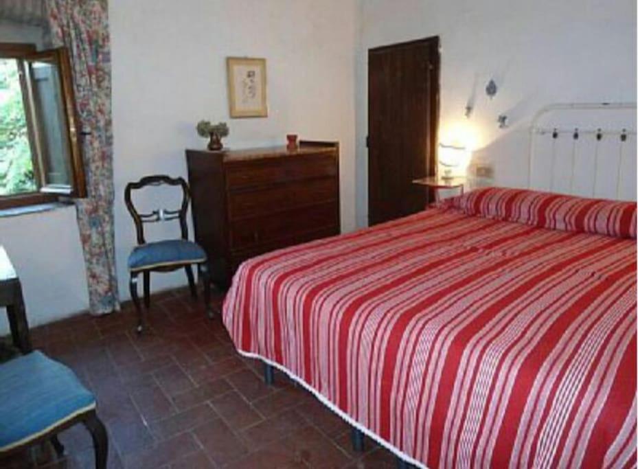 Posteľ alebo postele v izbe v ubytovaní Antica casa colonica in pietra in Toscana