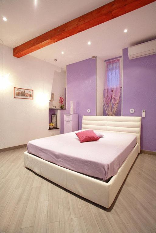 Postel nebo postele na pokoji v ubytování I Coralli rooms & apartments
