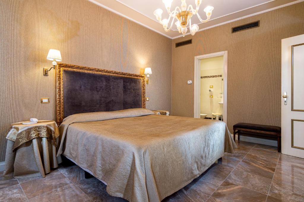 Postel nebo postele na pokoji v ubytování Hotel Santa Marina