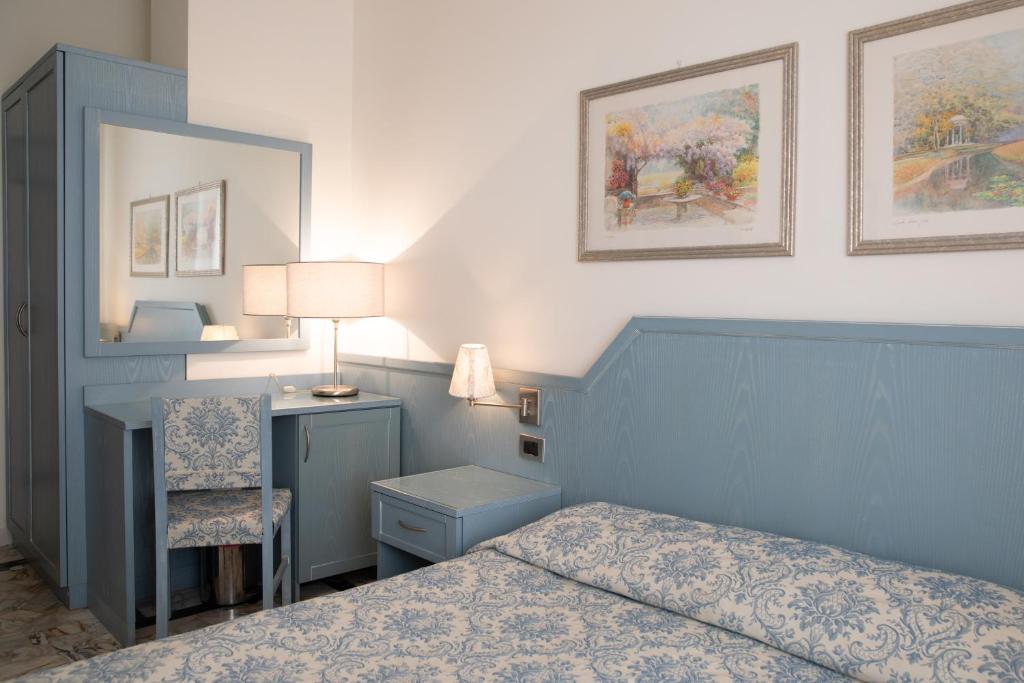 Postel nebo postele na pokoji v ubytování Hotel Ariston