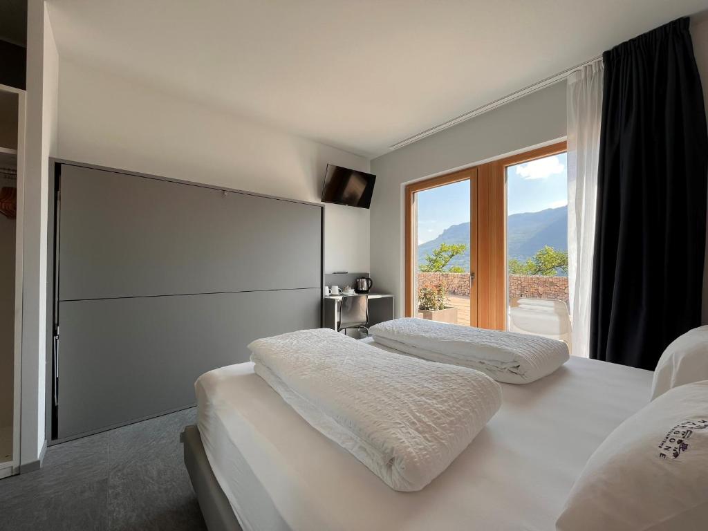 A bed or beds in a room at Agriturismo Margone