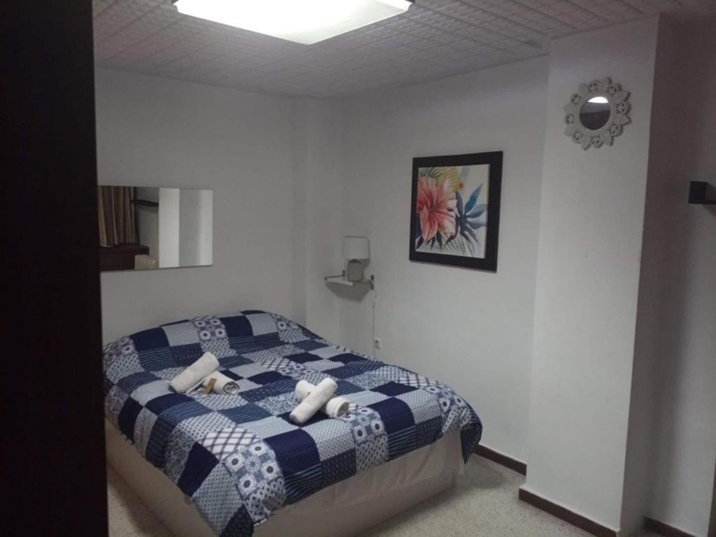 Postel nebo postele na pokoji v ubytování Malaguetor Home