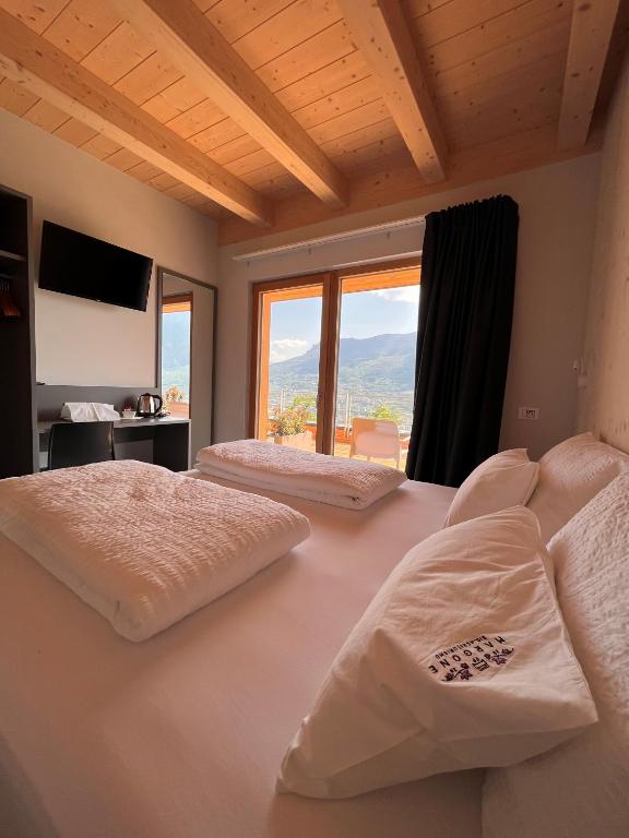 A bed or beds in a room at Agriturismo Margone