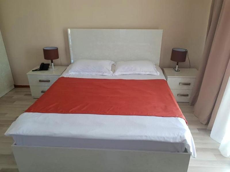 Postel nebo postele na pokoji v ubytování Hotel Tsereteli