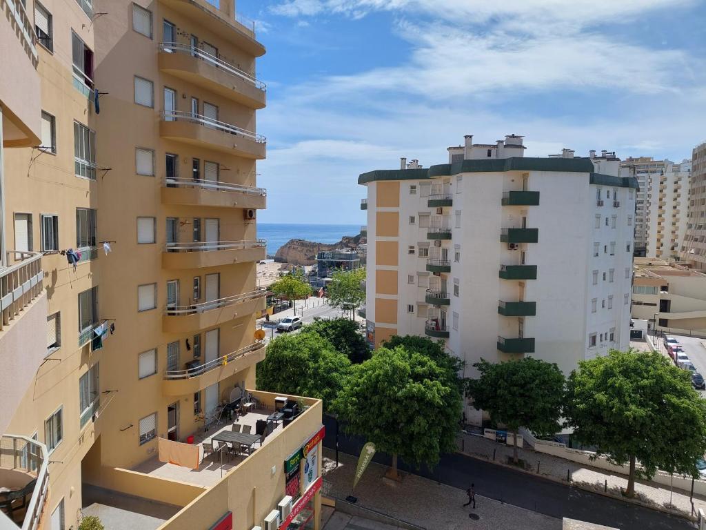 an aerial view of two buildings in a city at Alltravel Safira Apartment in Portimão