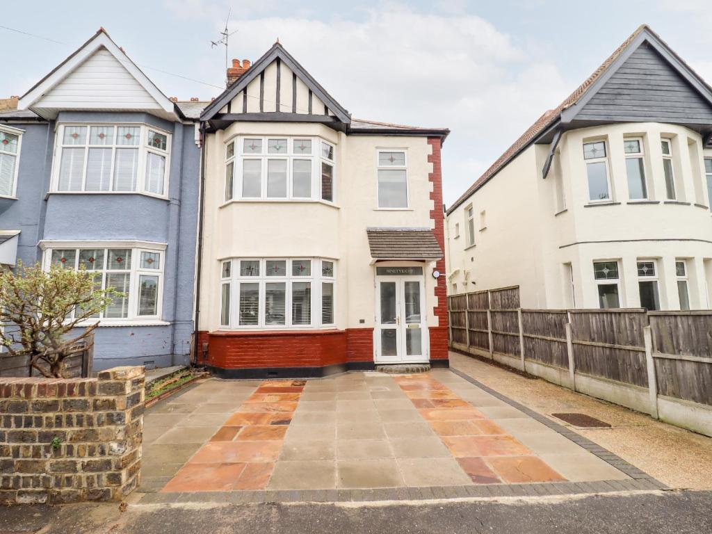 a row of houses in front of a fence at Ninety Eight in Southend-on-Sea