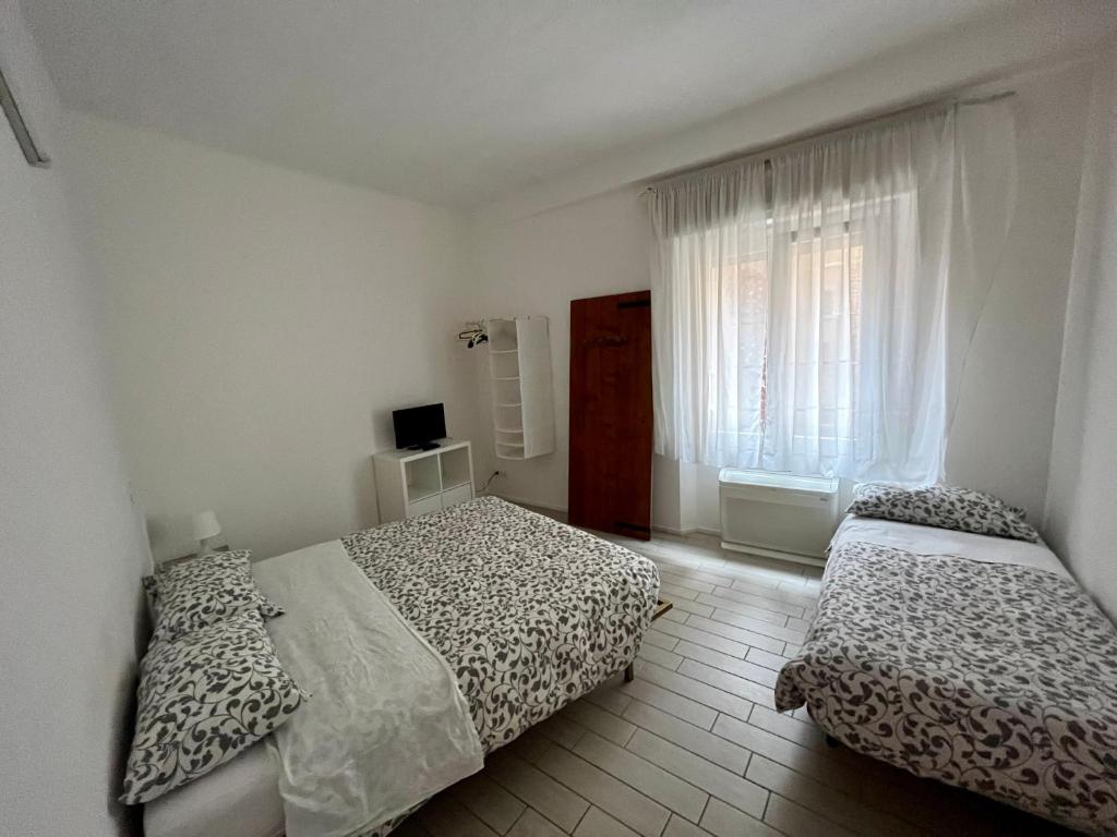 Postel nebo postele na pokoji v ubytování Il Guasco Rooms