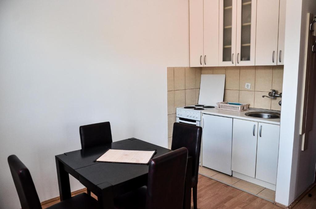 Kuchyň nebo kuchyňský kout v ubytování Helena Apartments