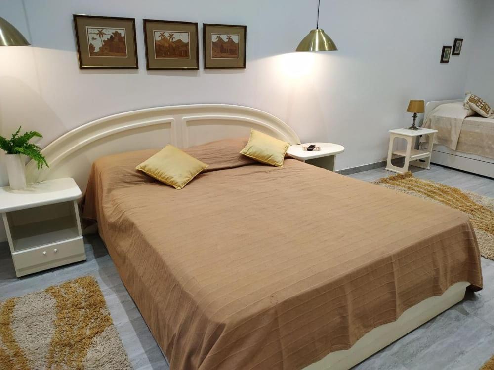 a bedroom with a large bed with two pillows on it at Jasmin at Bayview in Pembroke
