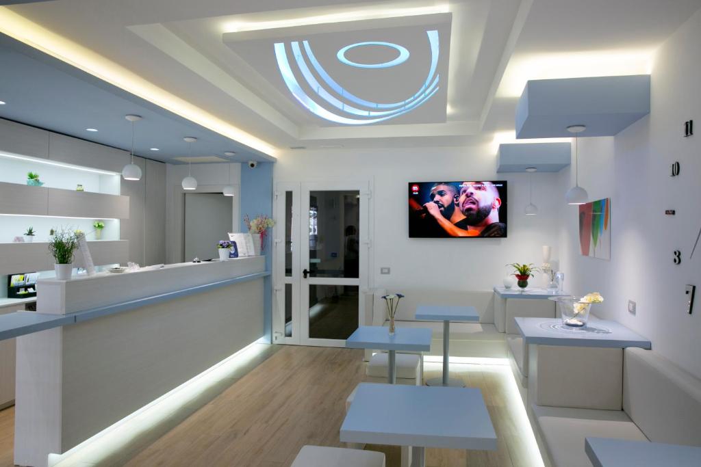 a dental office with a tv on the ceiling at Hotel Perla Gaia in San Vito lo Capo