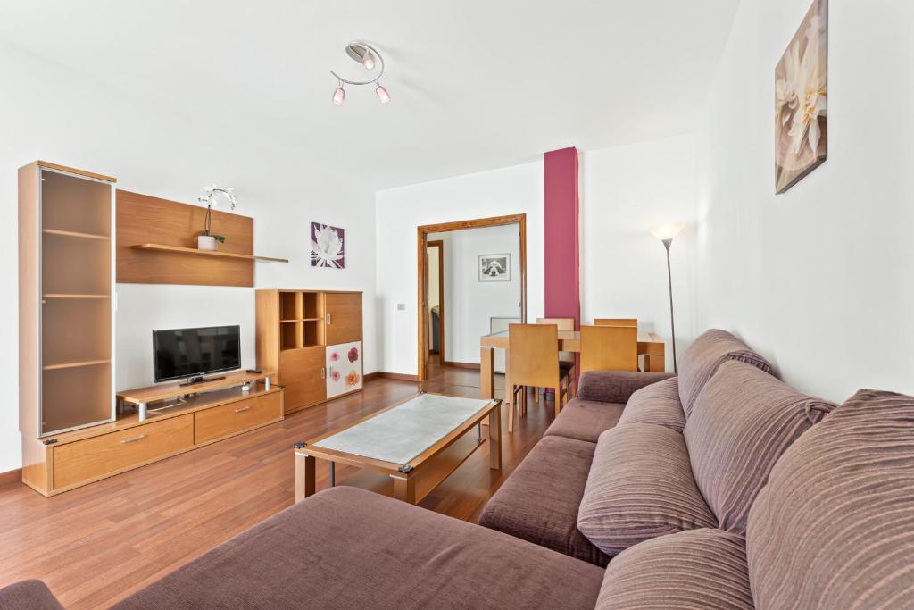 a living room with a couch and a table at Apartamento Leon 2 in Arrecife