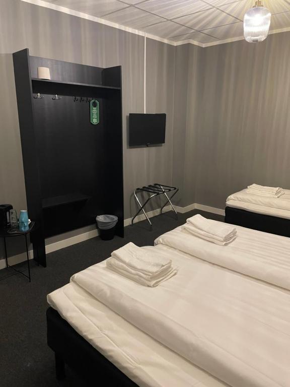 Postel nebo postele na pokoji v ubytování Birka Hotel