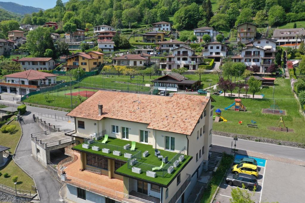 an aerial view of a house with a green roof at EderaRooms in Cerano d'Intelvi