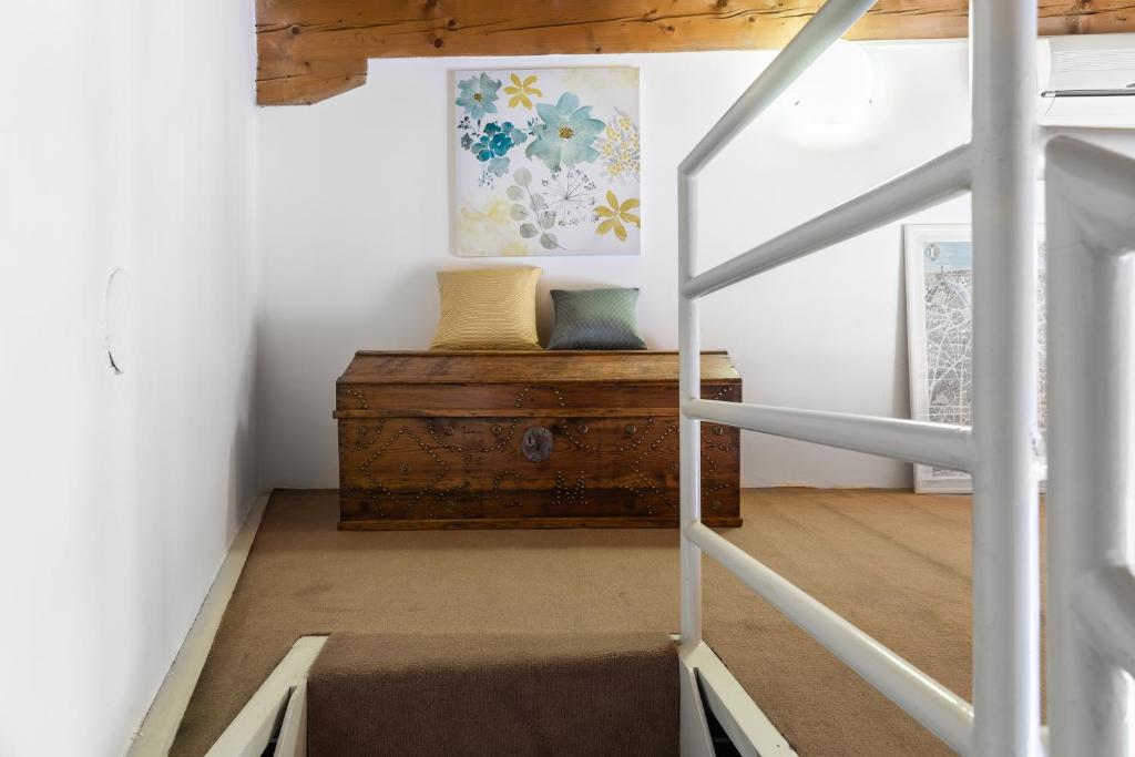 Postel nebo postele na pokoji v ubytování A Casa Nuccia Mansarda by Holiday Solutions
