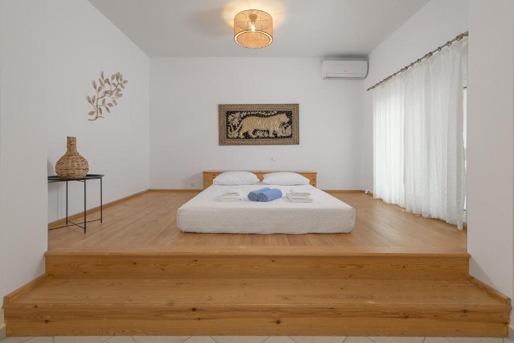 Postel nebo postele na pokoji v ubytování Villa Evelyn