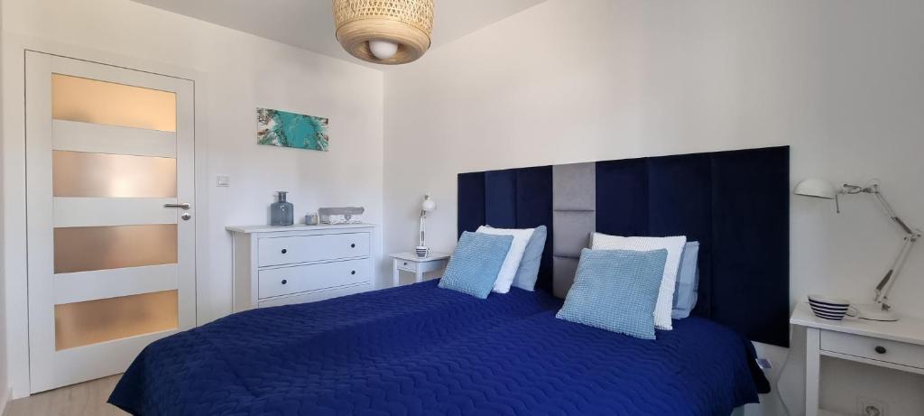 Cama ou camas em um quarto em Apartament Azzurro