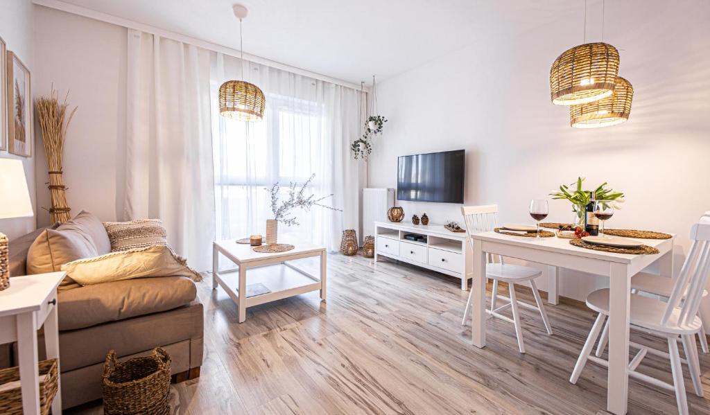 Televízia a/alebo spoločenská miestnosť v ubytovaní Apartament No 6 - HOME APART