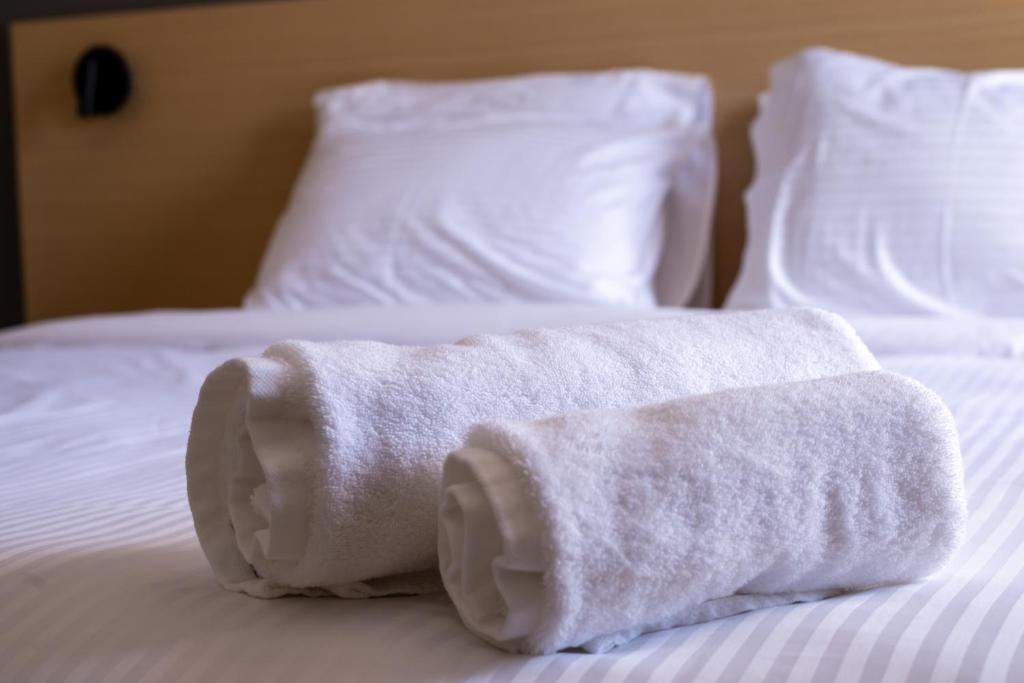 Postel nebo postele na pokoji v ubytování Onar hotel