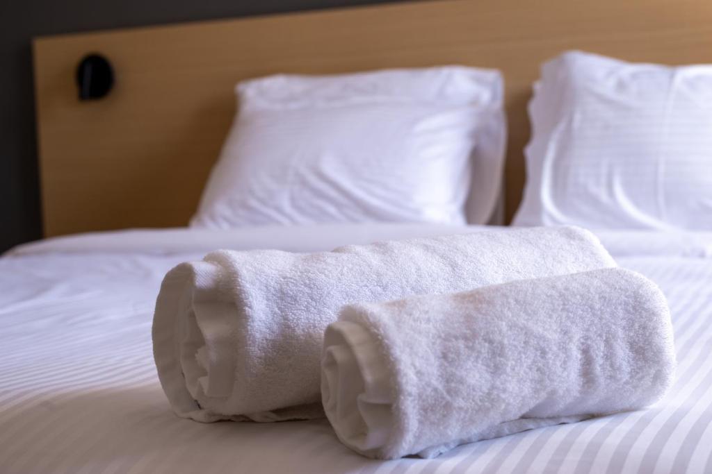 Postel nebo postele na pokoji v ubytování Onar hotel