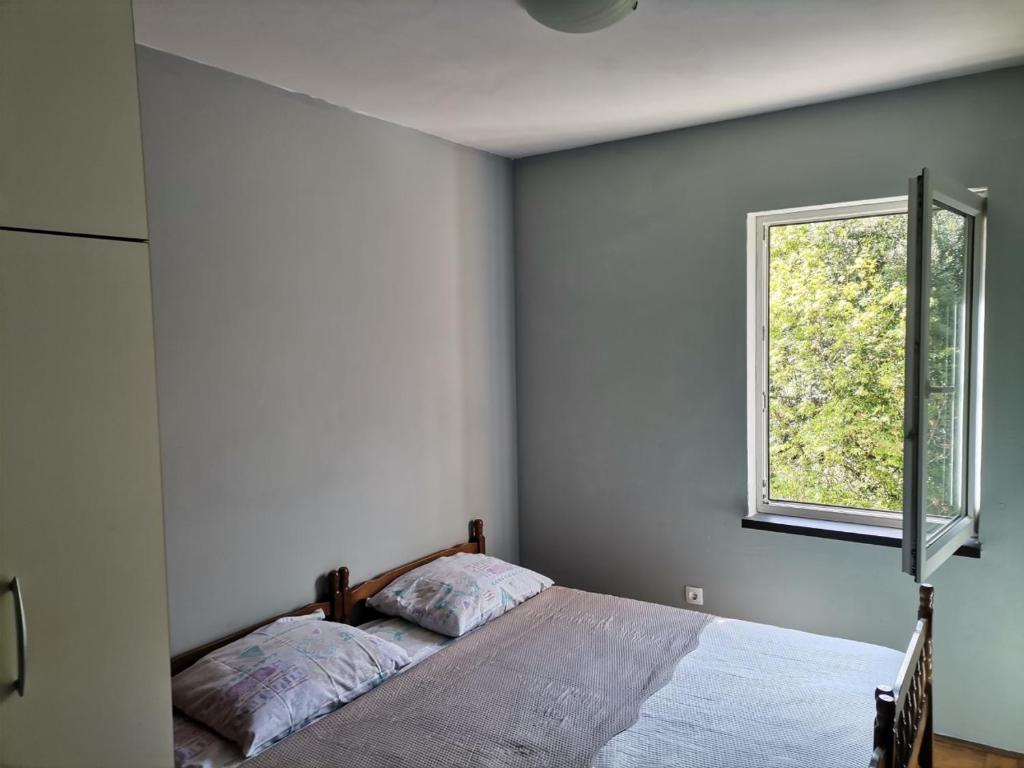 Ein Bett oder Betten in einem Zimmer der Unterkunft Apartment T&T