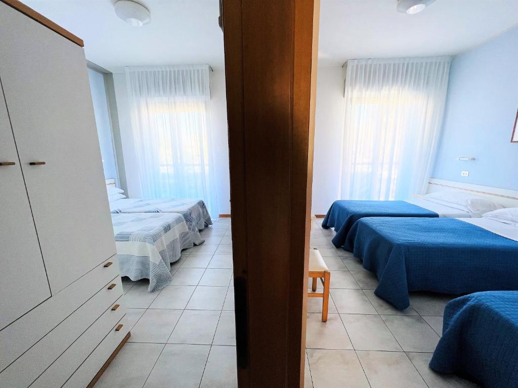 Postel nebo postele na pokoji v ubytování Hotel Betty Personal Style and Beach Village