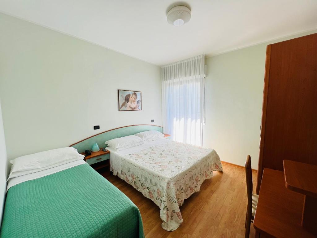 Postel nebo postele na pokoji v ubytování Hotel Betty Personal Style and Beach Village
