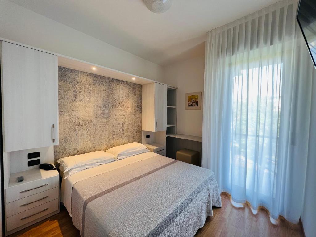 Postel nebo postele na pokoji v ubytování Hotel Betty Personal Style and Beach Village