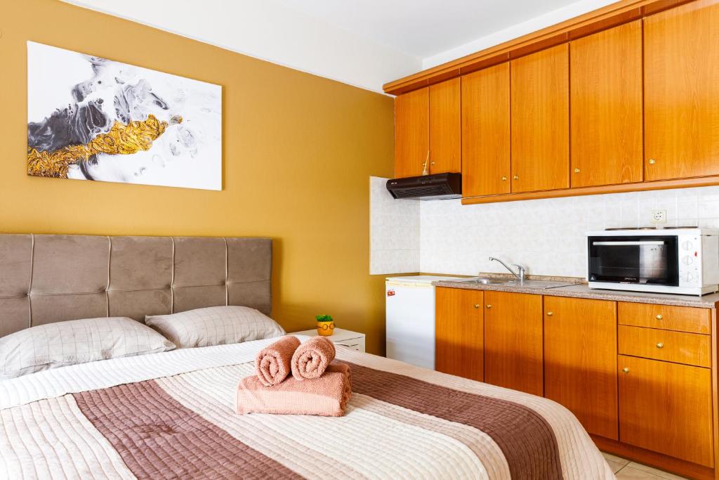 Postel nebo postele na pokoji v ubytování Blaze Studios & Apartments