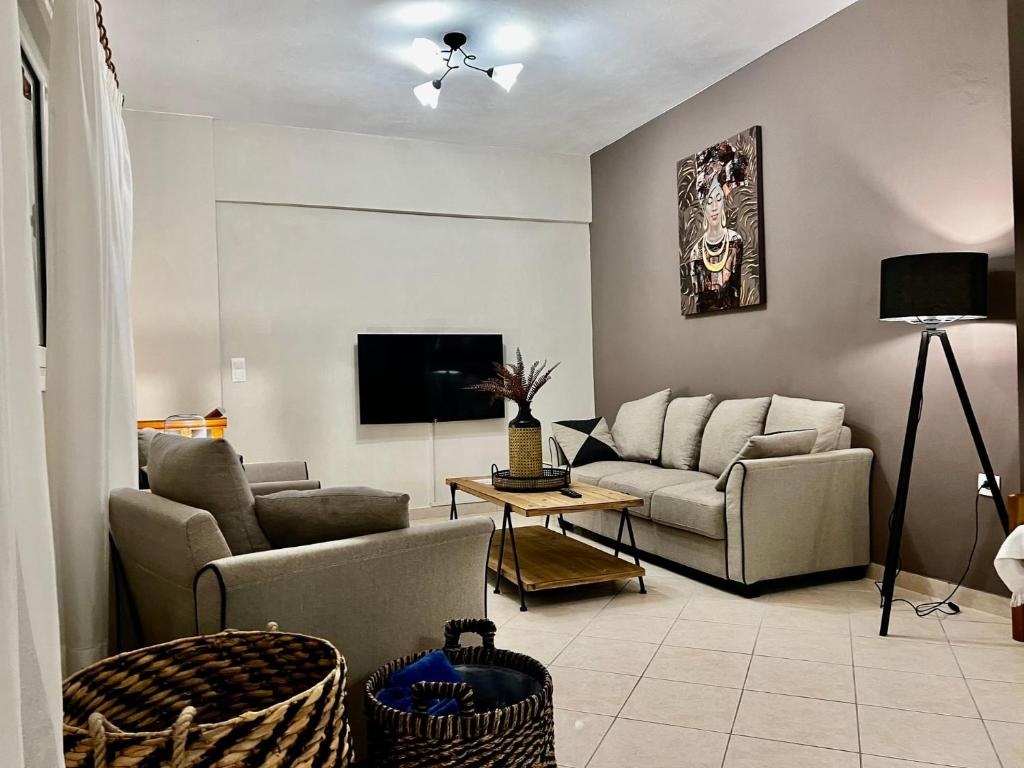 TV a/nebo společenská místnost v ubytování IONIAN SUITES by Bruskos
