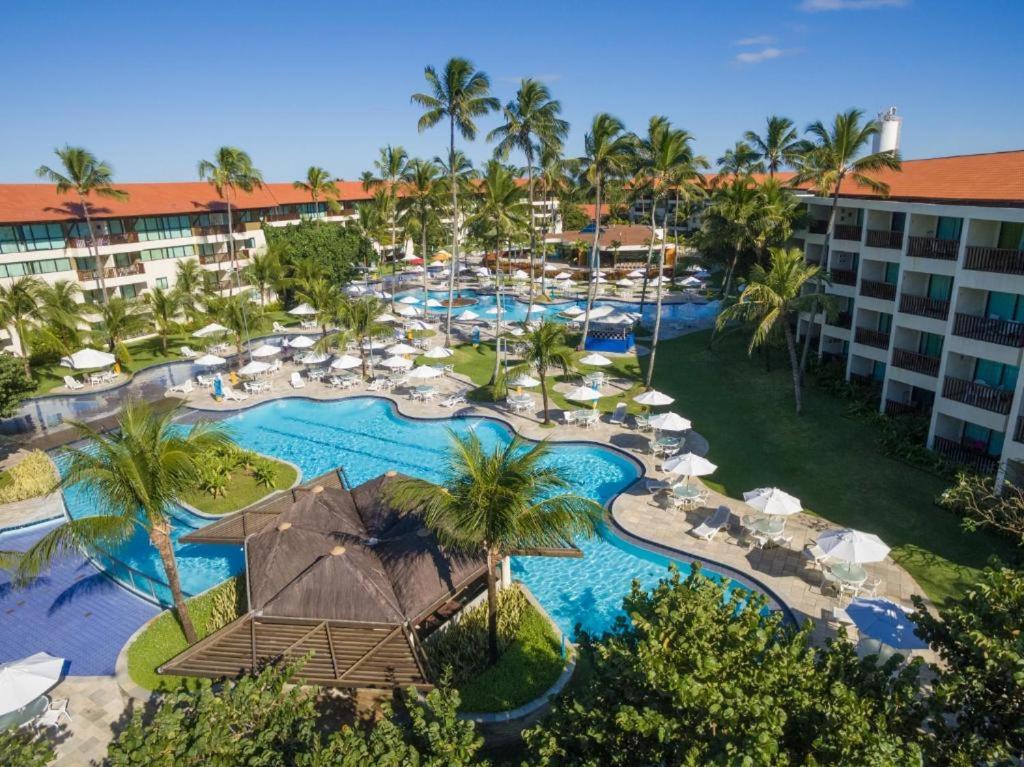 an aerial view of a resort with a swimming pool at Flat Experience Marulhos Resort in Porto De Galinhas