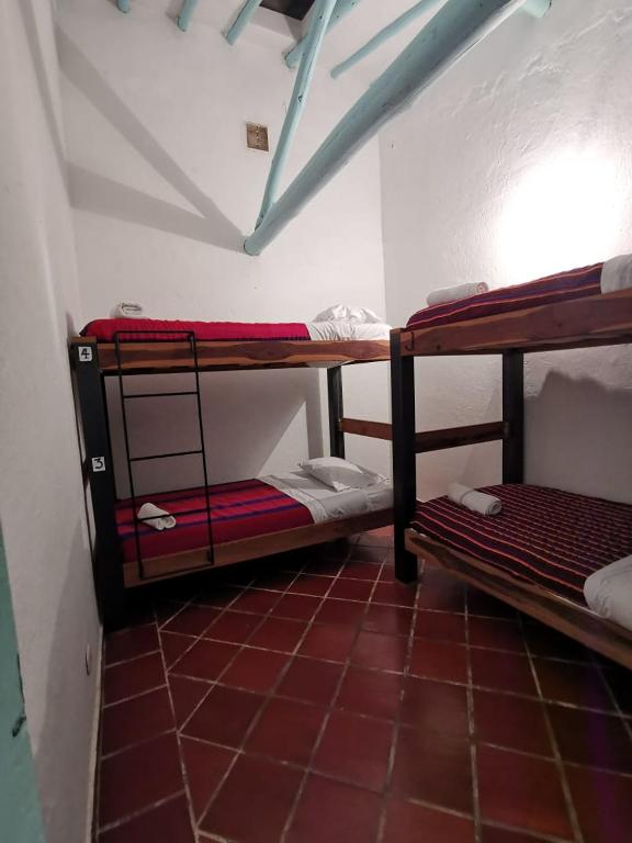 Postel nebo postele na pokoji v ubytování Popichi Hostel