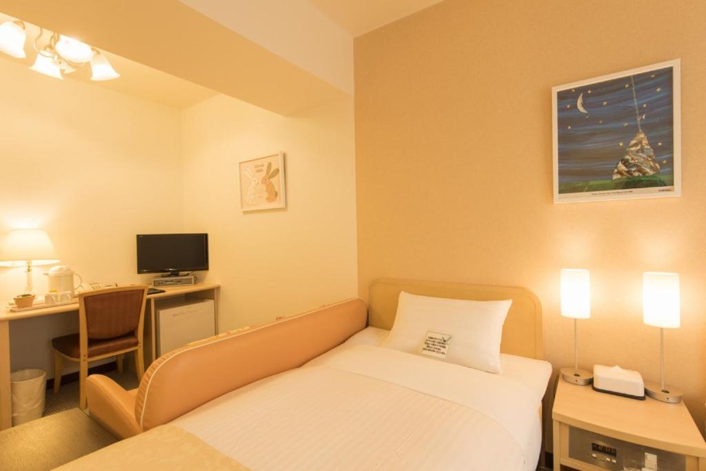 Postel nebo postele na pokoji v ubytování Hotel Famy Inn Kinshicho