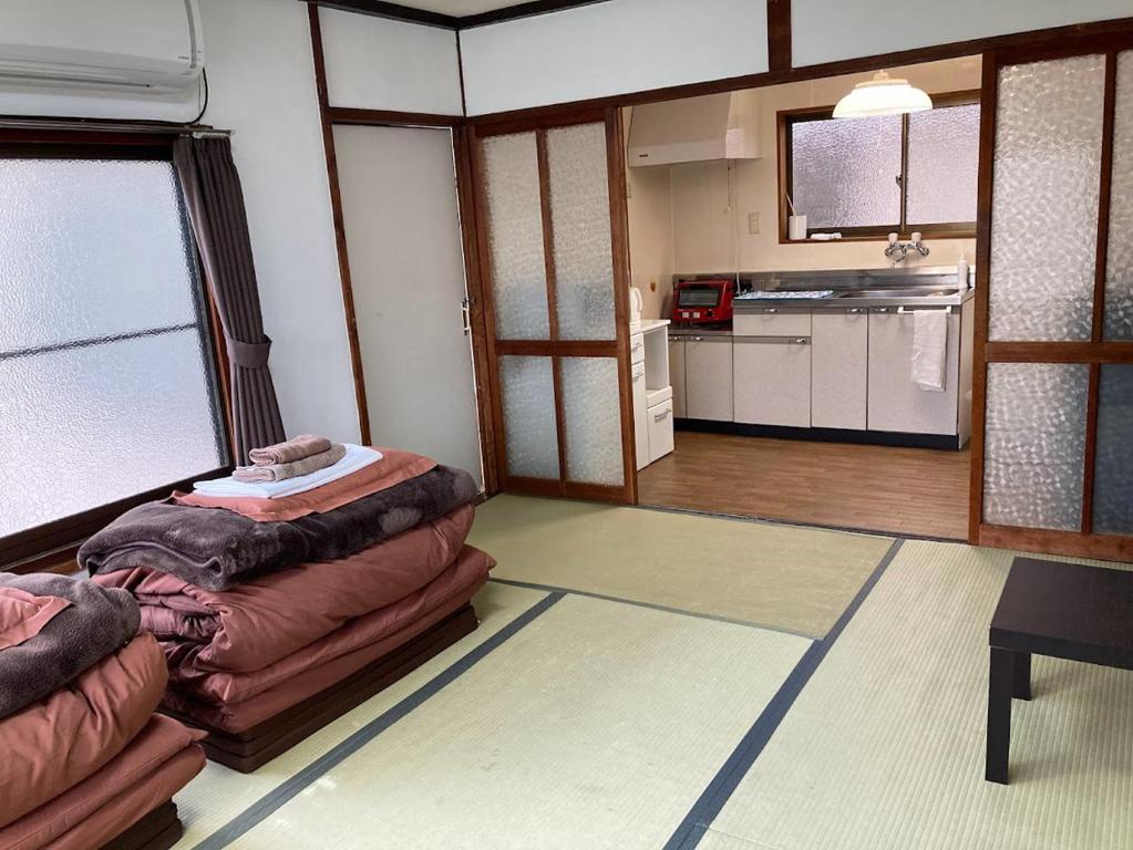 Kuchyň nebo kuchyňský kout v ubytování ゲストハウス尾道ポポー Guesthouse Onomichi Pawpaw