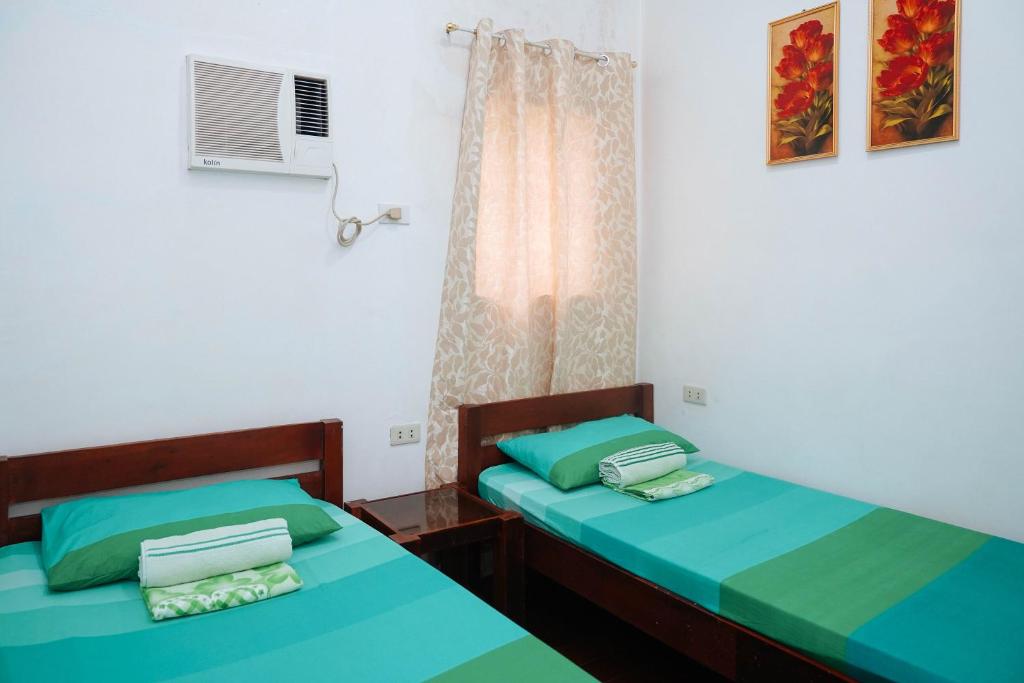 Postel nebo postele na pokoji v ubytování C Star Travellers Inn