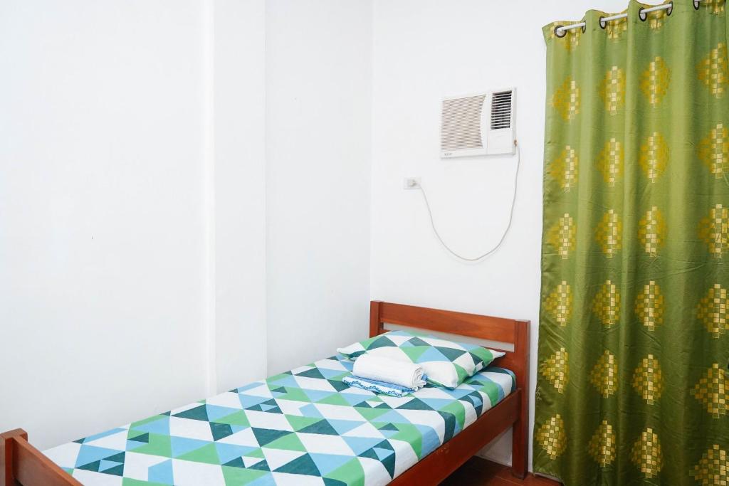 Postel nebo postele na pokoji v ubytování C Star Travellers Inn