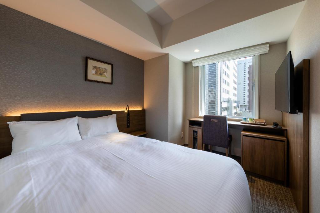 Postel nebo postele na pokoji v ubytování Hotel Rilassare Tokyo