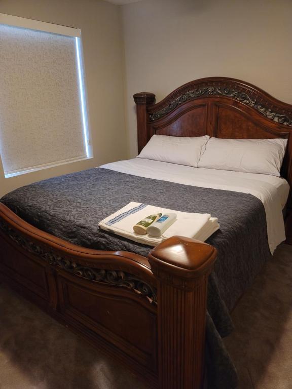 a bed with a wooden frame with a tray on it at Jule Sleep in Denver