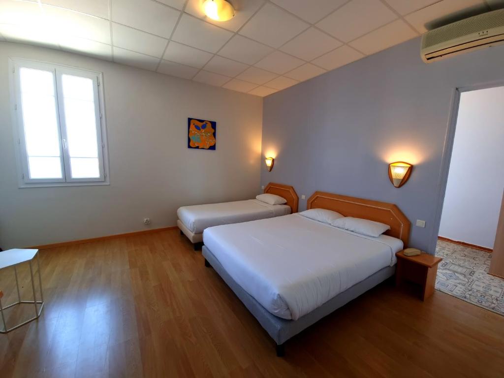 Postel nebo postele na pokoji v ubytování Hôtel Sole Mare