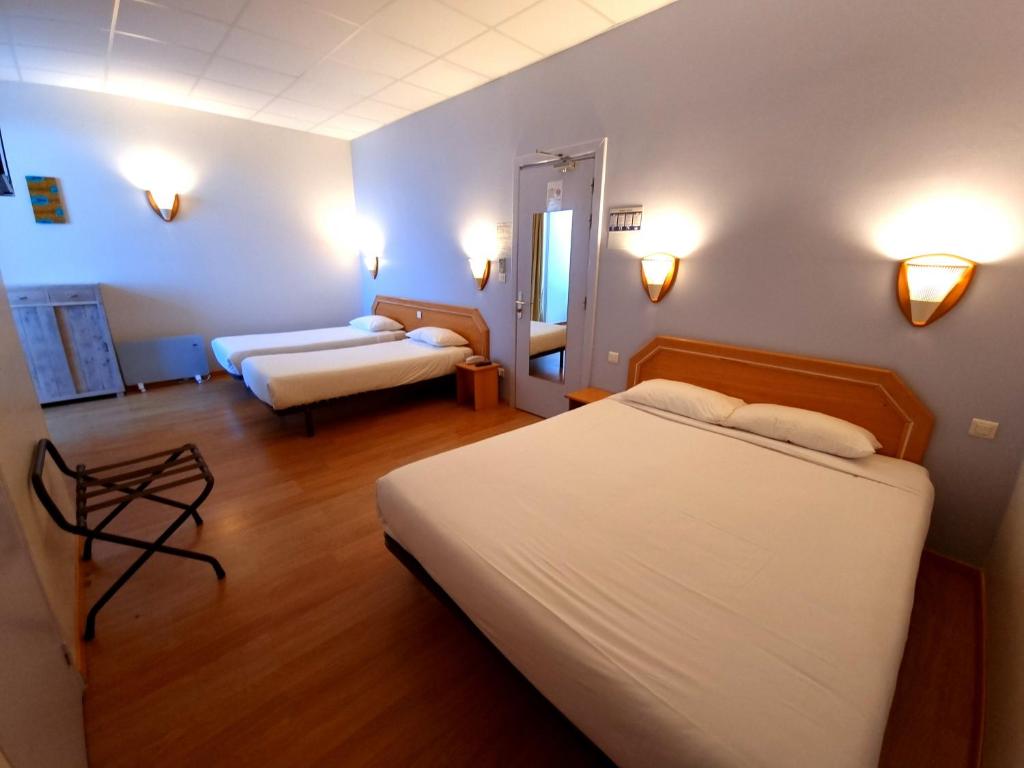 Postel nebo postele na pokoji v ubytování Hôtel Sole Mare
