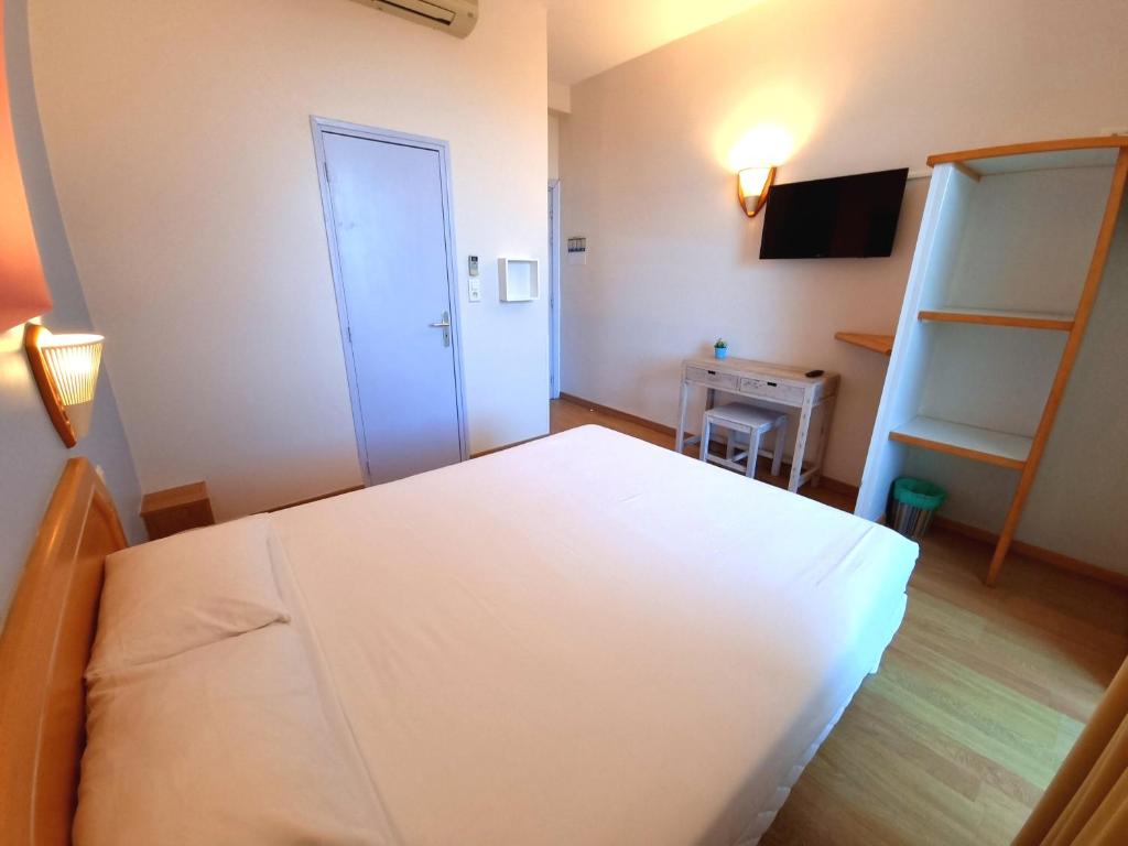 Postel nebo postele na pokoji v ubytování Hôtel Sole Mare