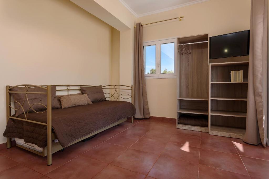 A bed or beds in a room at Villa Melody Complex