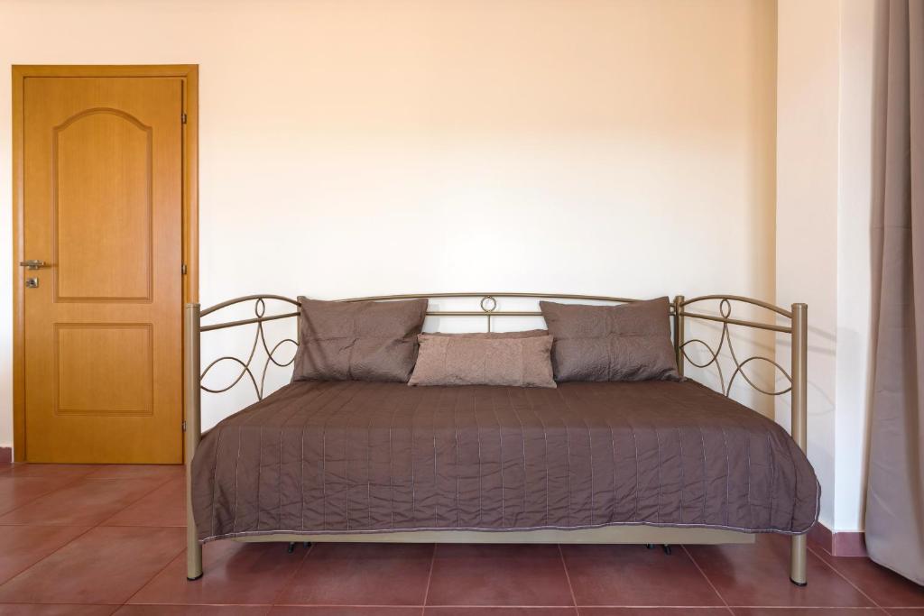 A bed or beds in a room at Villa Melody Complex