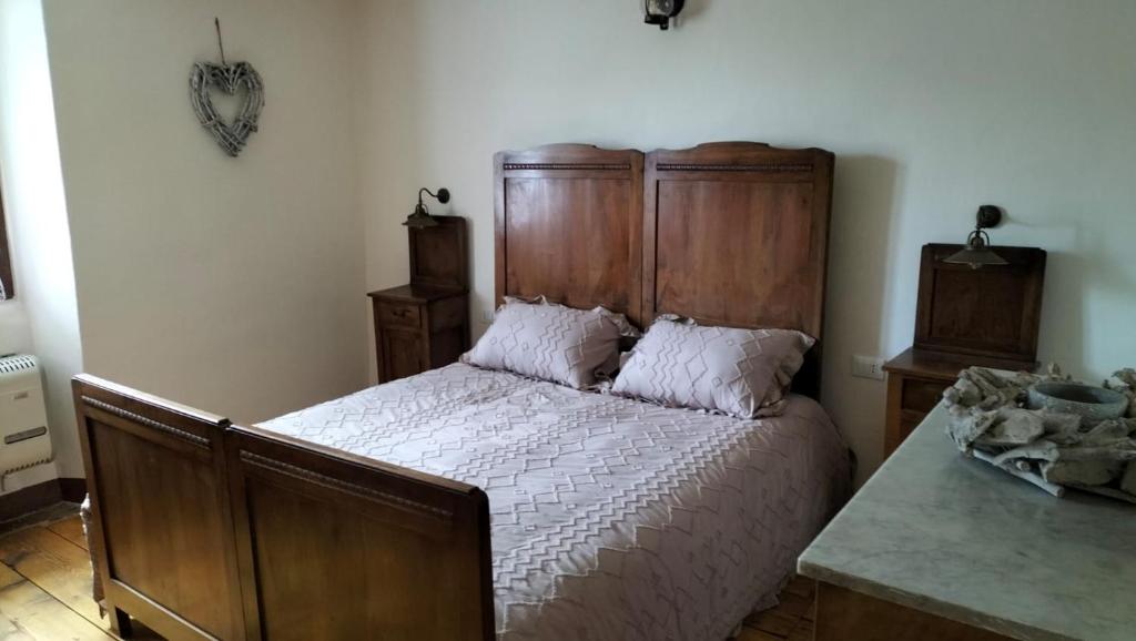 Postel nebo postele na pokoji v ubytování LA CA' DEI COMARI - Locanda da Tullio