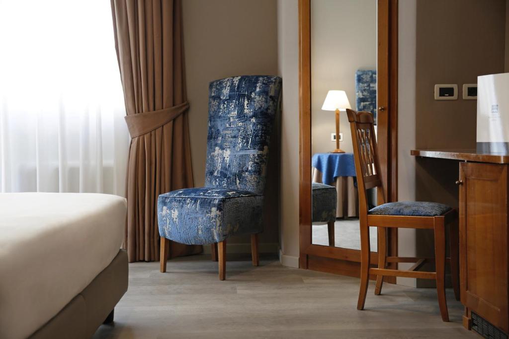 Postel nebo postele na pokoji v ubytování BeYou Hotel Ponte Milvio
