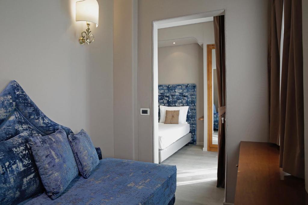 Postel nebo postele na pokoji v ubytování BeYou Hotel Ponte Milvio