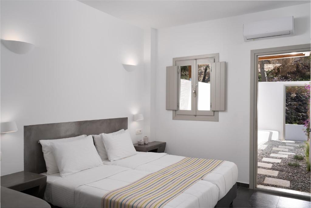 Letto o letti in una camera di Hotel Goulielmos