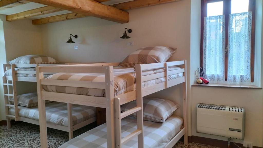 Postel nebo postele na pokoji v ubytování LA CA' DEI COMARI - Locanda da Tullio