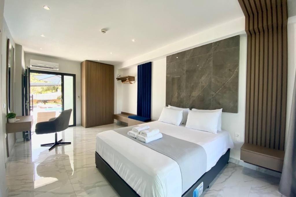 Posteľ alebo postele v izbe v ubytovaní V luxury Suites